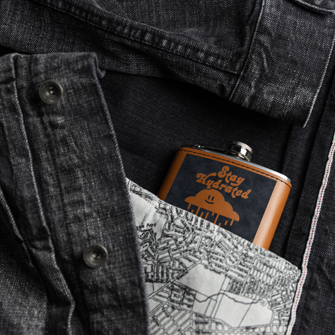 Flasks – Light brown leather Flask with laser engraved design in the pocket of a denim jacket – Lifestyle view