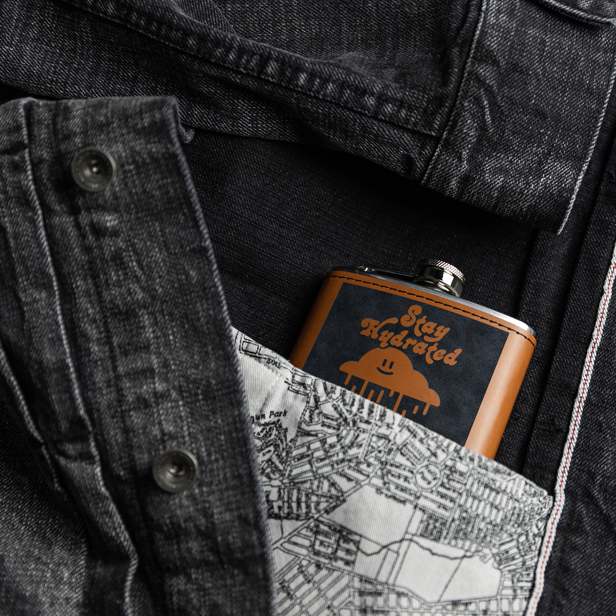 Flasks – Light brown leather Flask with laser engraved design in the pocket of a denim jacket – Lifestyle view