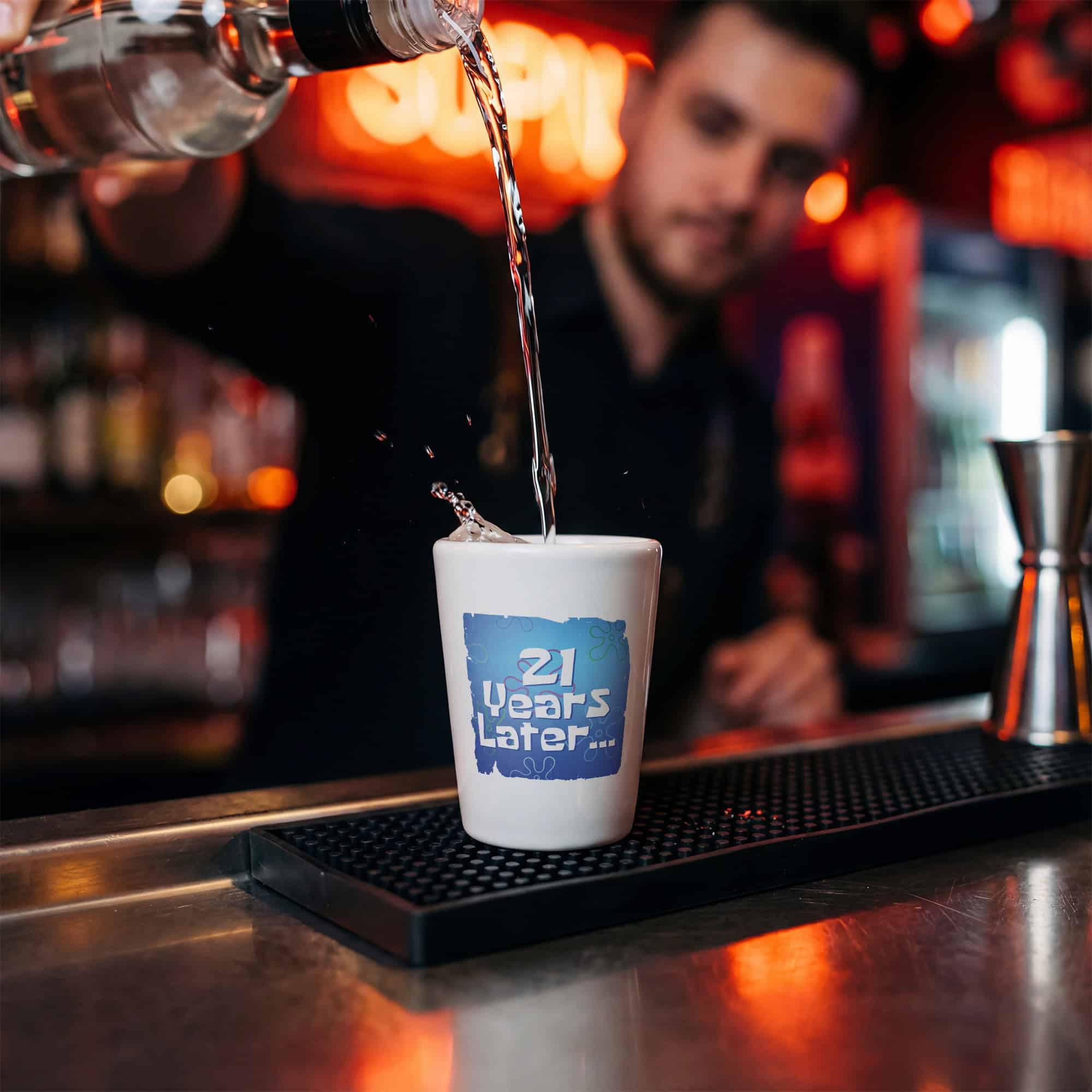 Ceramic Shot Glass – Bartender pouring a drink into a white Ceramic Shot Glass at a bar – Lifestyle view
